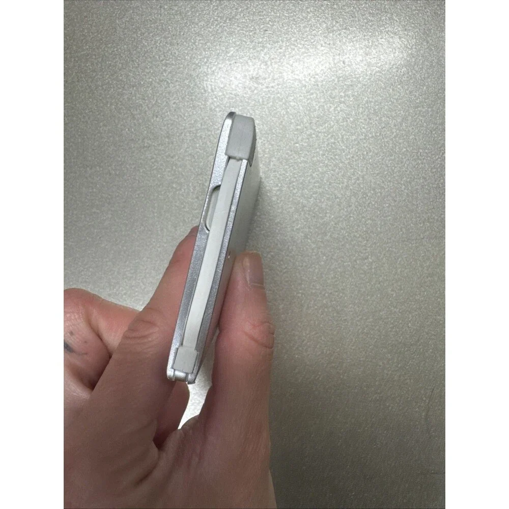 Ultra Slim portable charger silver with looks like Micro-USB cord see photos